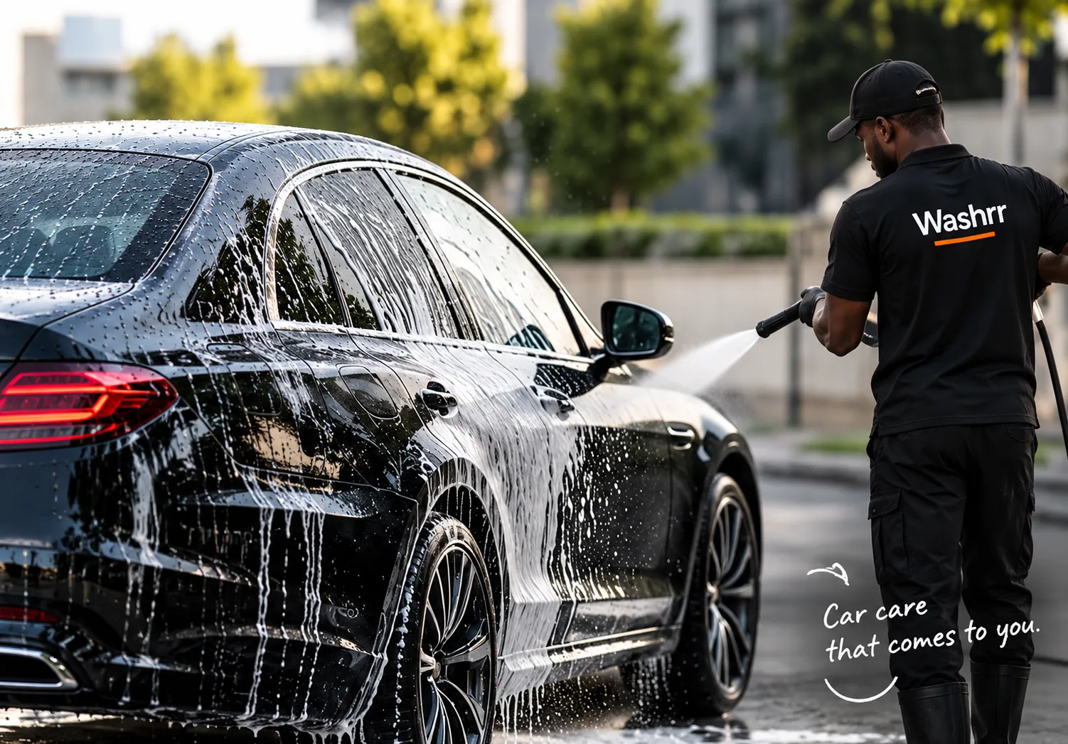Car care that comes to you. A Washrr washer rinsing a car outdoors.